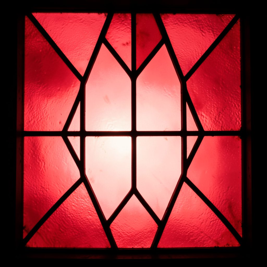 Stained-glass composition with bold leaded segments in soft rose, lavender, and pale turquoise, gentle and luminous